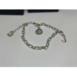 A BOXED SILVER THOMAS SABO BRACELET WITH CHARMS