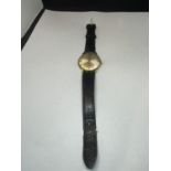 A GRADUS VINTAGE WRISTWATCH WITH LEATHER STRAP SEEN WORKING BUT NO WARRANTY