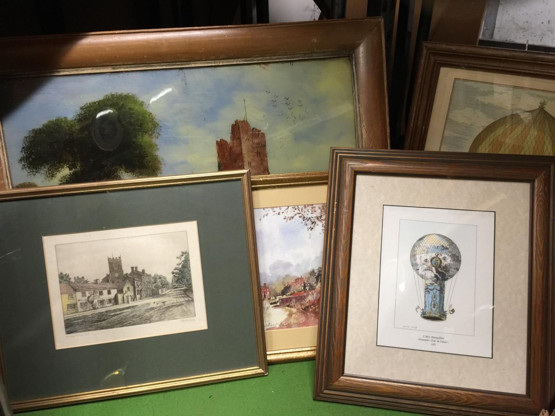 A FRAMED PAINTING OF A CASTLE ON GLASS, TWO FRAMED BALLOON PRINTS, A STREET SCENE AND A CHURCH - Image 2 of 2