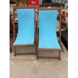 A PAIR OF TEAK FOLDING GARDEN DECK CHAIRS