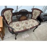 A VICTORIAN MAHOGANY AND PROFUSELY INLAID PARLOUR SETTEE WITH FAN BACK, ON FRONT CABRIOLE LEGS