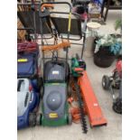 A FLYMO GARDEN VAC, A HEDGE TRIMMER AND A CHALLENGE ELECTRIC LAWN MOWER