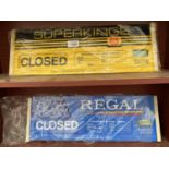 A REGAL AND A SUPERKINGS SHOP OPENING SIGN