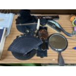 A COLLECTION OF VINTAGE ITEMS INCLUDING BLACK AND FLORAL BOOK RESTS, HAND MIRROR AND BRUSH SET,