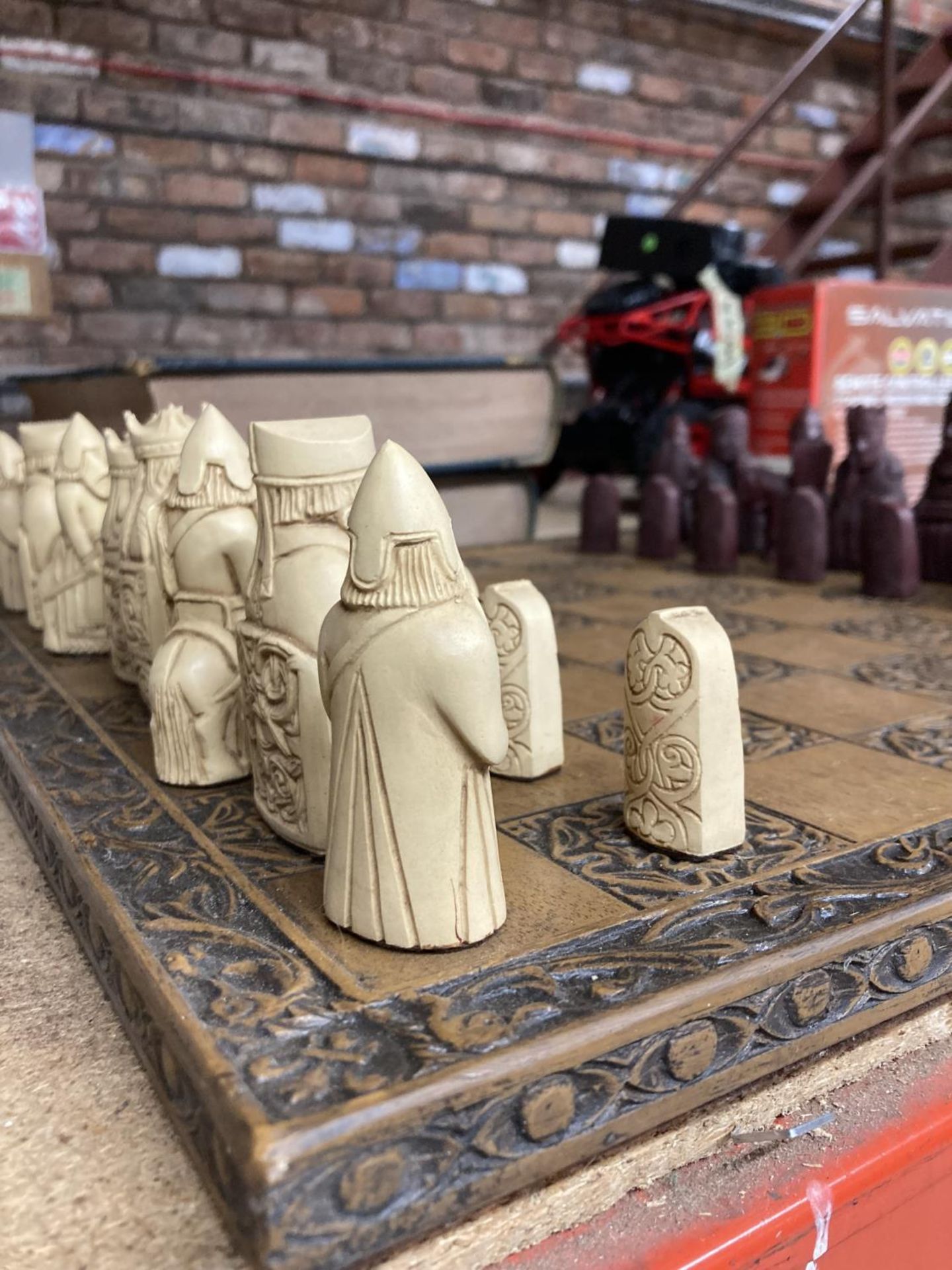 A CARVED WOODEN CHESS BOARD WITH A FULL SET OF CHESSMEN - Image 2 of 3