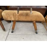 A VINTAGE POMMEL HORSE WITH HOOP BARS, ON FOUR ADJUSTABLE LEGS, 65X24" MAX WITH SUEDE TOP