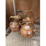 FOUR VARIOUS VINTAGE COPPER KETTLES