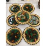 A SET OF SIX WEDGWOOD MAJOLICA MOTTLED RETICULATED DESSERT SERVICE PLATES FOR SIX WITH CAKE