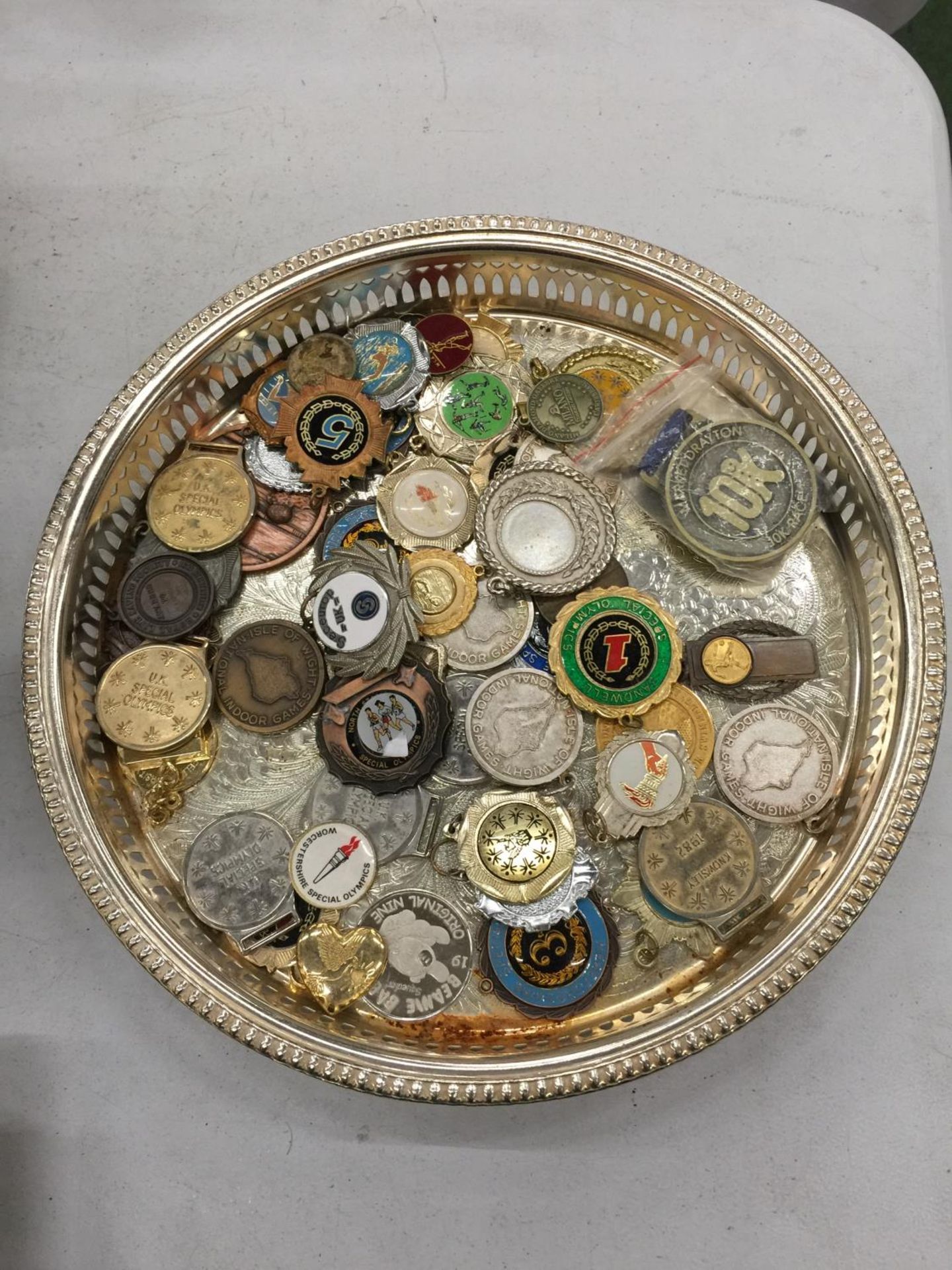 A SILVER PLATED TRAY CONTAINING AN AMOUNT OF 'MEDALS' - Image 2 of 2