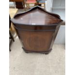 A REPRODUCTION MAHOGANY AND INLAID CORNER CUPBOARD