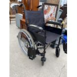 A FOLDING WHEEL CHAIR