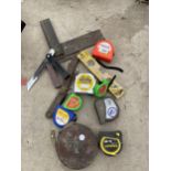 AN ASSORTMENT OF TOOLS TO INCLUDE TAPE MEASURES AND SET SQUARES ETC
