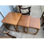 A RETRO TEAK G-PLAN STYLE NEST OF THREE TABLES