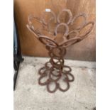 A DECORATIVE PLANTER FORMED FROM HORSE SHOES