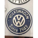 A CAST BLUE AND WHITE VOLKSWAGON SIGN DIAMETER 19.5CM