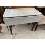 A 1950'S FORMICA TOP DROP LEAF TABLE