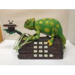 A TELEPHONE IN THE SHAPE OF A CHAMELEON ON A LOG