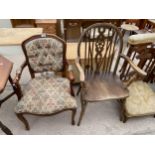A CONTINENTAL STYLE ELBOW CHAIR AND WHEELBACK WINDSOR STYLE CHAIR