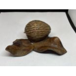 A CARVED WOODEN NUT AND LEAF INKWELL