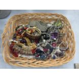 A BASKET OF COSTUME JEWELLERY TO INCLUDE CHOKER STYLE NECKLACES, BANGLES, BRACELETS, ETC