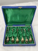 A BOXED SET OF SIX DECORATIVE SPOONS MARKED 800