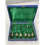 A BOXED SET OF SIX DECORATIVE SPOONS MARKED 800