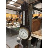 AN OAK CASED CARVED BAROMETER LENGTH 84CM