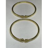 TWO SILVER GILT BANGLES