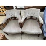 A PAIR OF VICTORIAN MAHOGANY TUB CHAIRS ON TURNED LEGS