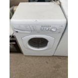 A WHITE HOTPOINT WASHING MACHINE