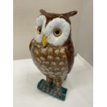 A LARGE CERAMIC MODEL OF AN OWL