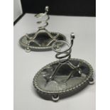 A PAIR OF SILVER PLATED CANDLESTICKS