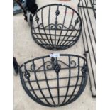 A PAIR OF DECORATIVE WROUGHT IRON HAY RACK PLANTERS