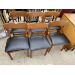 A SET OF SIX RETRO TEAK DINING CHAIRS WITH BLACK FAUX LEATHER SEATS
