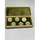 A SET OF MASONIC COLLAR STUDS IN A PRESENTATION BOX