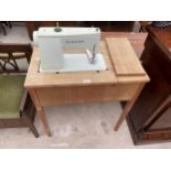 A SINGER 427 ELECTRIC SEWING MACHINE IN TABLE