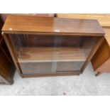 A RETRO TEAK GLASS TWO DOOR SLIDING BOOKCASE, 36" WIDE