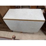 A MID 20TH CENTURY DROP-LEAF KITCHEN TABLE WITH FAUX MARBLE FORMICA TOP