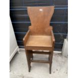 AN OAK ARTS & CRAFTS CHILDS SIZE TALL CHAIR