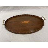 A LARGE MAHOGANY TRAY WITH BRASS HANDLES AND A SHELL DESIGN 57CM X 37CM