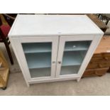 A MODERN TWO DOOR GLAZED CABINET, 27.5" WIDE