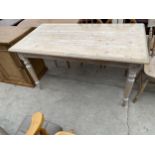 A VICTORIAN STYLE LIMED KITCHEN TABLE ON TURNED LEGS, 54X30" WITH SINGLE DRAWER