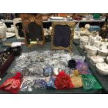 A QUANTITY OF COSTUME JEWELLERY TO INCLUDE EARRINGS, NECKLACES, BEADS, ETC, PLUS A DRESSING TABLE