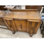 AN ART DECO SIDEBOARD ENCLOSING THREE CUPBOARDS AND INTERNAL DRAWERS, 47" WIDE