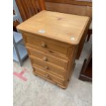 A MODERN PINE FOUR DRAWER BEDROOM CHEST