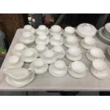 A QUANTITY OF WEDGWOOD WHITE CUPS, SAUCERS, PLATES, SAUCE BOAT, TUREEN, ETC