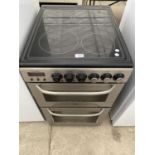 A SILVER AND BLACK ZANUSSI FREESTANDING OVEN AND HOB