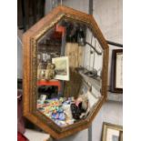 A WOODEN FRAMED OCTAGONAL BEVELLED MIRROR 79CM X 64CM