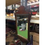 A VINTAGE MAHOGANY FRAMED MIRROR 32.5CM X 64CM