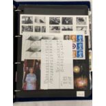 THE BLUE HAGNER BINDER CONTAINING QE11 UNMOUNTED MINT COMMEMORATIVES AND DEFINITIVES UPTO 2013 .